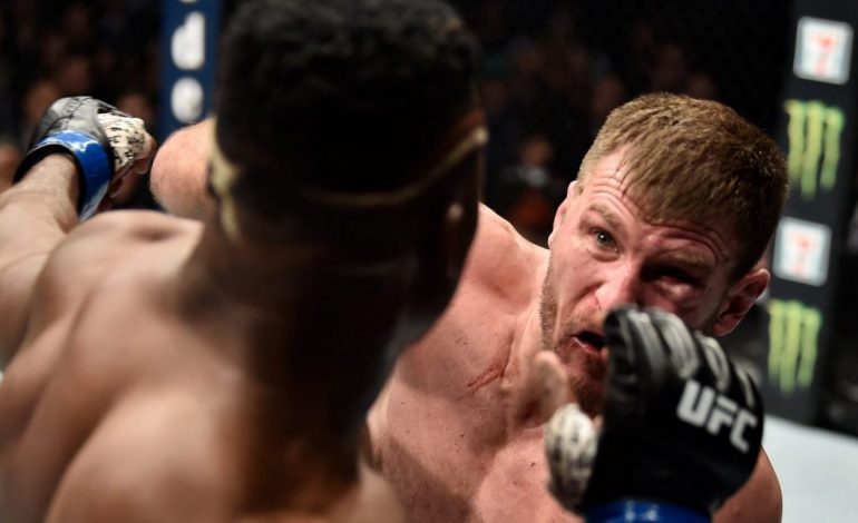 Miocic i jep leksion “bishës” Ngannou, shkruan historinë e UFC