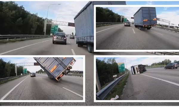 SHOFERIN E ZË GJUMI NË TIMON/ Shihni momentin kur kamioni përmbyset në mes të rrugës (VIDEO)