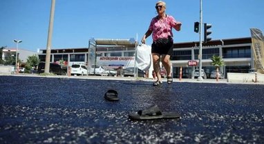 FOTOLAJM/ I nxehti ekstrem, qytetarëve u shkrijnë shapkat në mes të rrugës