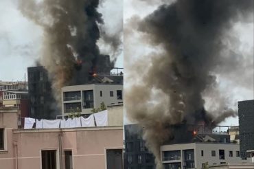 PAMJET E FRIKSHME/ Shtëllunga gjigante tymi, zjarr i fuqishëm në një pallat te Rruga Kavajës